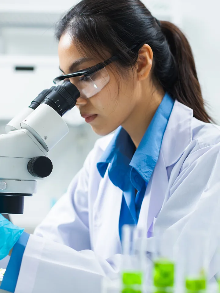 scientist woman with a microscope