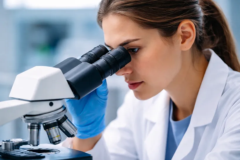 microscope analyzing hair sample