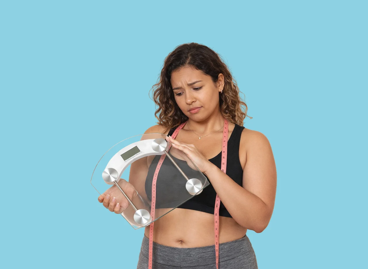 depressed overweight woman in a gym
